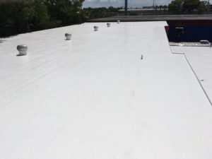 white flat roof replacement for a local business in Tampa